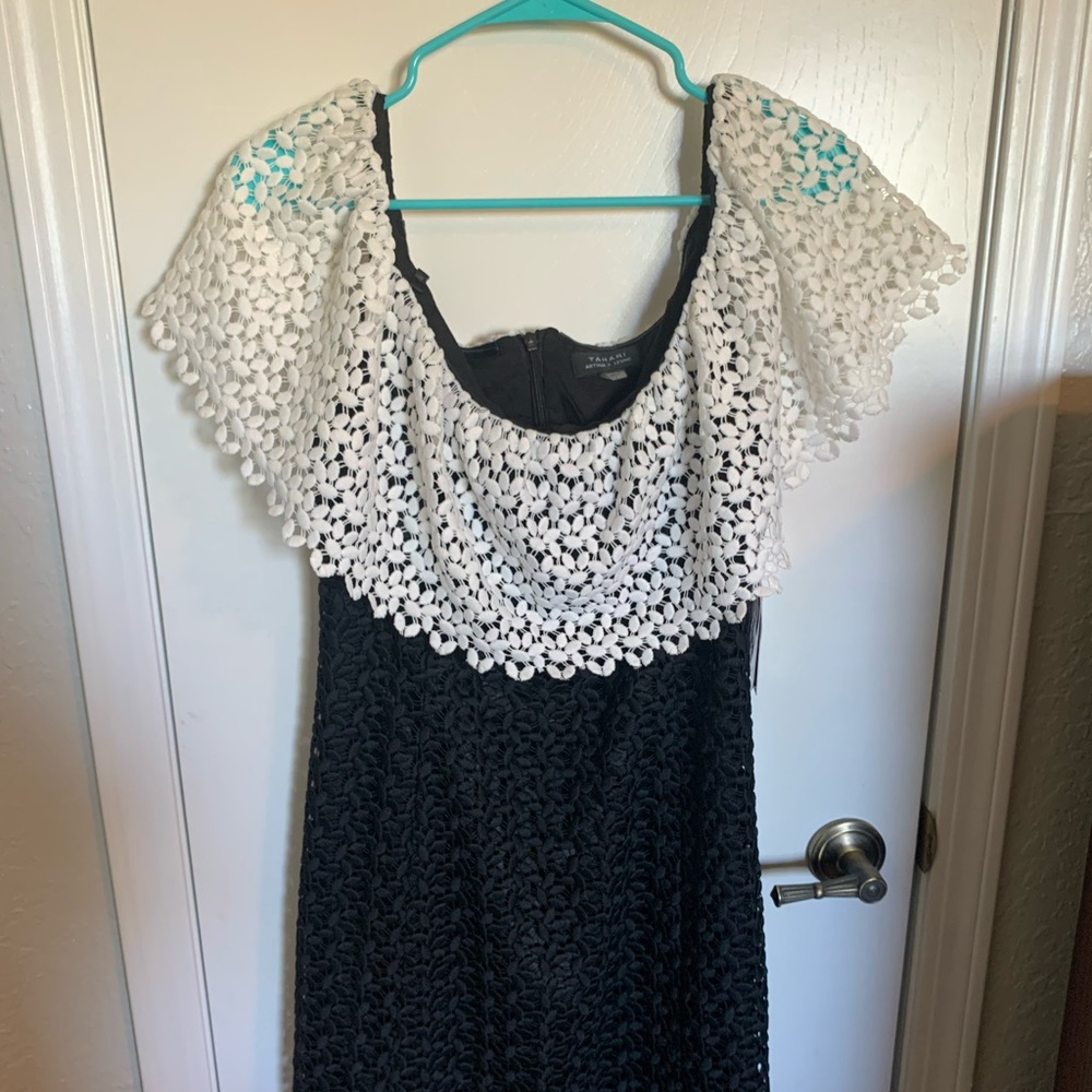 Off the shoulder black and white lace dress.